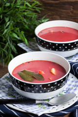 Vegetarian red soup - borsch in green bowl.