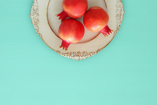Rosh hashanah (jewish New Year holiday) concept. Pomegranate raditional symbol.