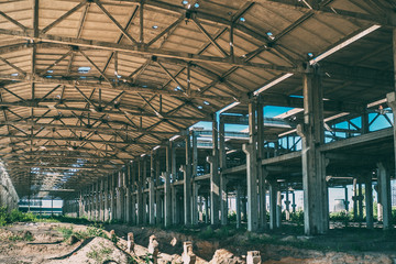 Abandoned concrete construction with columns like tunnel or corridor