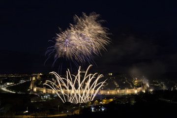 night views of fireworks in the city of Avila in Spain, medieval walled city perfectly preserved
