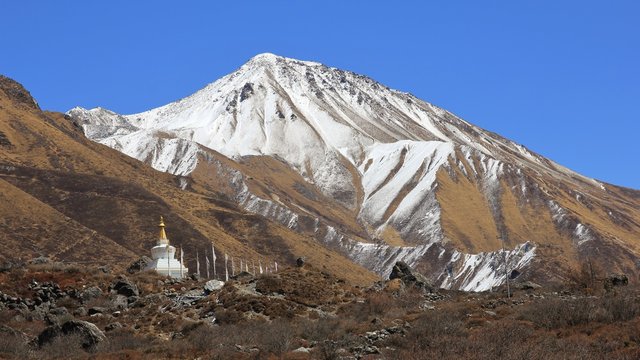 Mount Tserko Ri and small stupa. Spring scene in the Langtang valley.