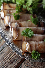 Eggplant rolls stuffed with cheese and garlic.