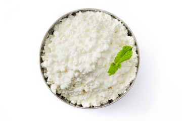 Fresh cottage cheese in a metal bowl isolated on white background. Top view