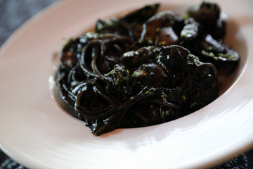 Spaghetti seafood with squid ink , Italian food