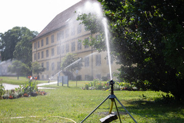 spinkle equipment on a green lawn