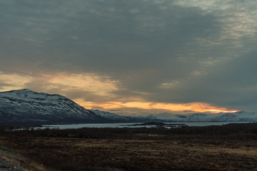 The frozen Torneträsk Lake in the Abisko National Park at sunset / Lapland, Sweden