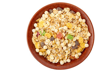 Bowl of muesli with dried exotic fruits on white