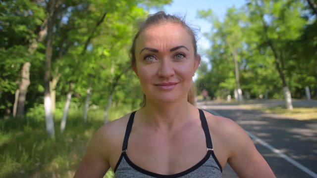 portrait of young sporty female runer looking at camera 