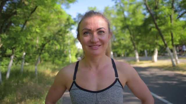 portrait of young sporty female runer looking at camera 