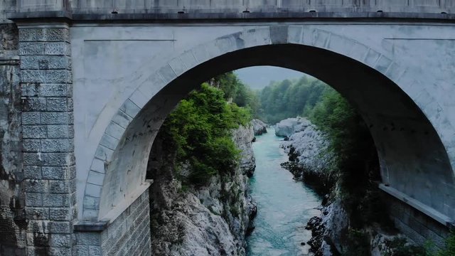 Flying under Napoleons Bridge on river Soca,Slovenia
