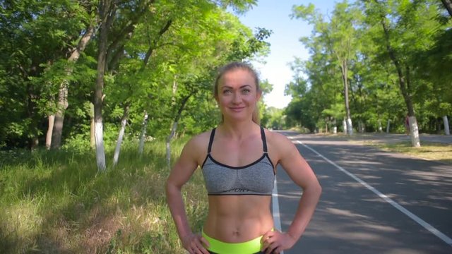 portrait of young sporty female runer looking at camera 