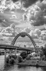 Zhivopisny Bridge the highest in Europe cable-stayed bridge over the Moscow river. Cloudy summer day. Dramatic black and white clouds . Moscow. Russia.