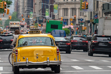 old yellow Taxi just married in traffic new york city