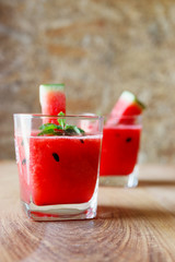 Watermelon drink on wooden background.