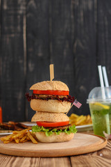 burgers on a slate plate and frothy beverage  - fast food (sandwich) - cuisine.  Food background