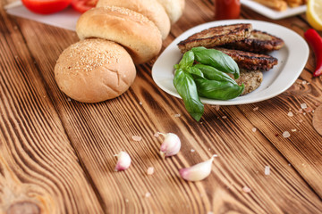 burgers on a slate plate and frothy beverage  - fast food (sandwich) - cuisine.  Food background