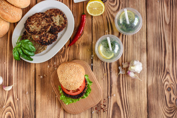 burgers on a slate plate and frothy beverage  - fast food (sandwich) - cuisine.  Food background