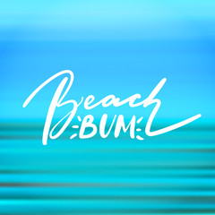 Fototapeta premium Beach bum - handwritten lettering, summer holiday quote on abstract blur unfocused style sky backdrop