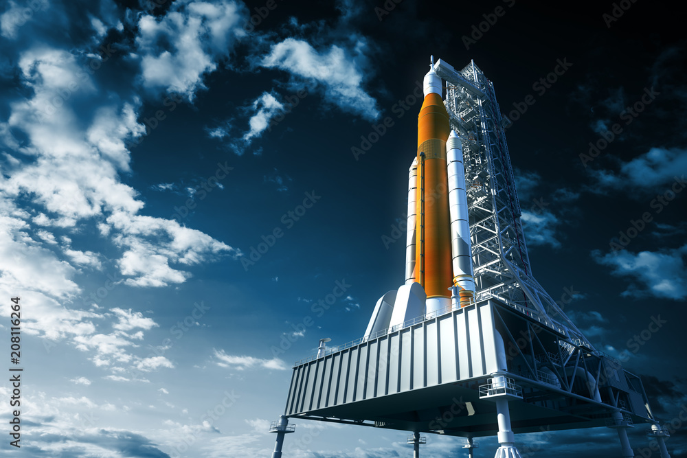 Wall mural space launch system on launchpad over background of sky