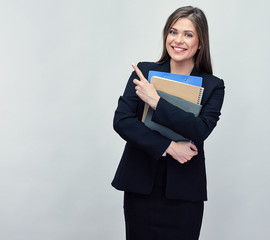Smiling woman in black suit holding business paper and pointing