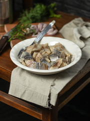  tasty herring. seafood on a plate (a herring fish in marinade) - cuisine.  Food background