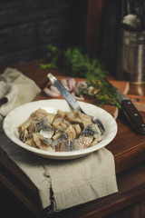  tasty herring. seafood on a plate (a herring fish in marinade) - cuisine.  Food background