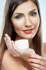 Beauty portrait young woman with skin care cream.