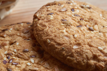 closeup oat large biscuits with sesame, flax and sunflower seeds. Macro