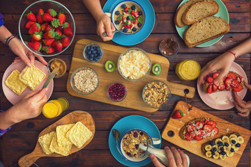 Young Happy Family Having Breakfast