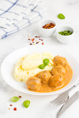 Meatballs with mashed potatoes, creamy tomato sauce, classic delicious food
