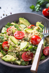 Quinoa salad with spinach, avocado and tomatoes