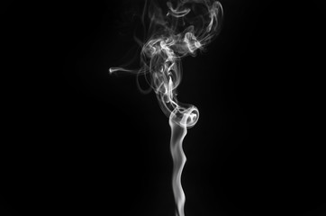 abstract beautiful fragment movement of burn white smoke on black background.