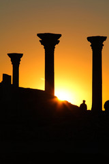 Fototapeta premium Beautiful sunset with silhouette of ancient columns at Chersonese of Taurida, Crimea.