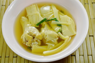 boiled bamboo shoot with chicken leg soup on bowl