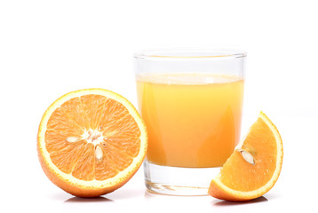 Fresh oranges and juice in a glass, isolated on a white. Horizontal photo.