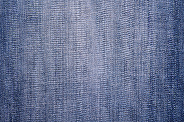 Denim fabric close-up. Background. Blue colour.
