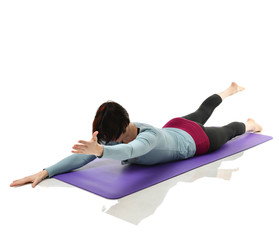Mother woman exercising doing postnatal workout. Female fitness stretching hands and legs in gym...