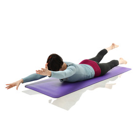 Mother woman exercising doing postnatal workout. Female fitness stretching hands and legs in gym...