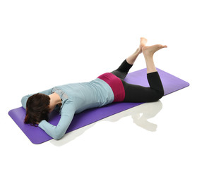 Mother woman exercising doing postnatal workout. Female fitness stretching hands and legs in gym...