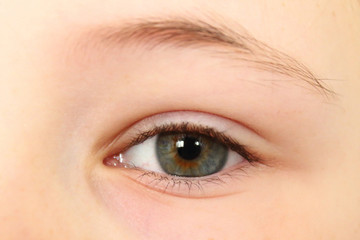 Obraz premium Beautiful eye girl close-up. Background. A child's view.