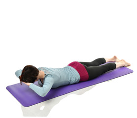 Mother woman exercising doing postnatal workout. Female fitness stretching hands and legs in gym...