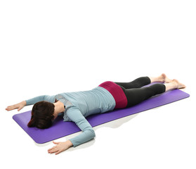 Mother woman exercising doing postnatal workout. Female fitness stretching hands and legs in gym...
