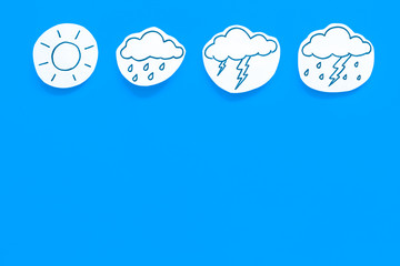 Modern weather icons set on blue background top view copy space