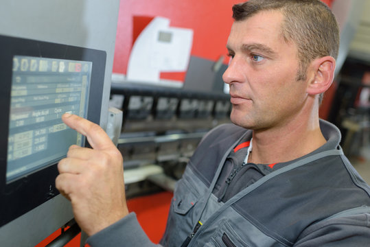 Worker using touch screen technology