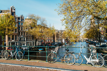 Fototapeta premium Beautiful Architecture Of Dutch Houses and Houseboats On Amsterdam Canal In Autumn