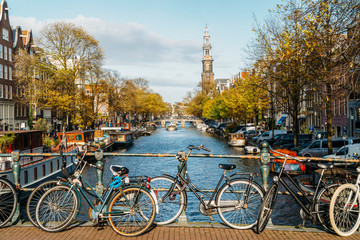 Fototapeta premium Beautiful Architecture Of Dutch Houses and Houseboats On Amsterdam Canal In Autumn