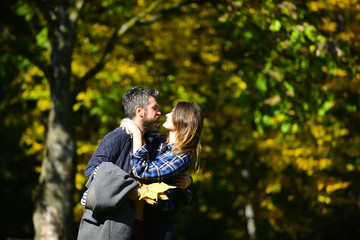 Man and woman with passionate faces on natural background.