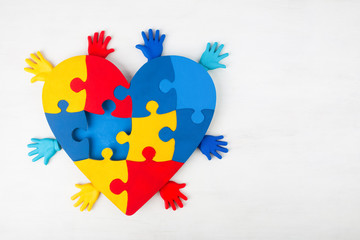 puzzle heart hands support autism awareness