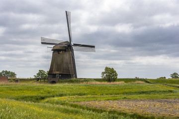 Fototapeta na wymiar country landscape with dutch windmill. Oterleek netherlands holland
