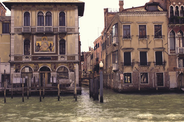 Row of old buildings along canal in Venice, Italy